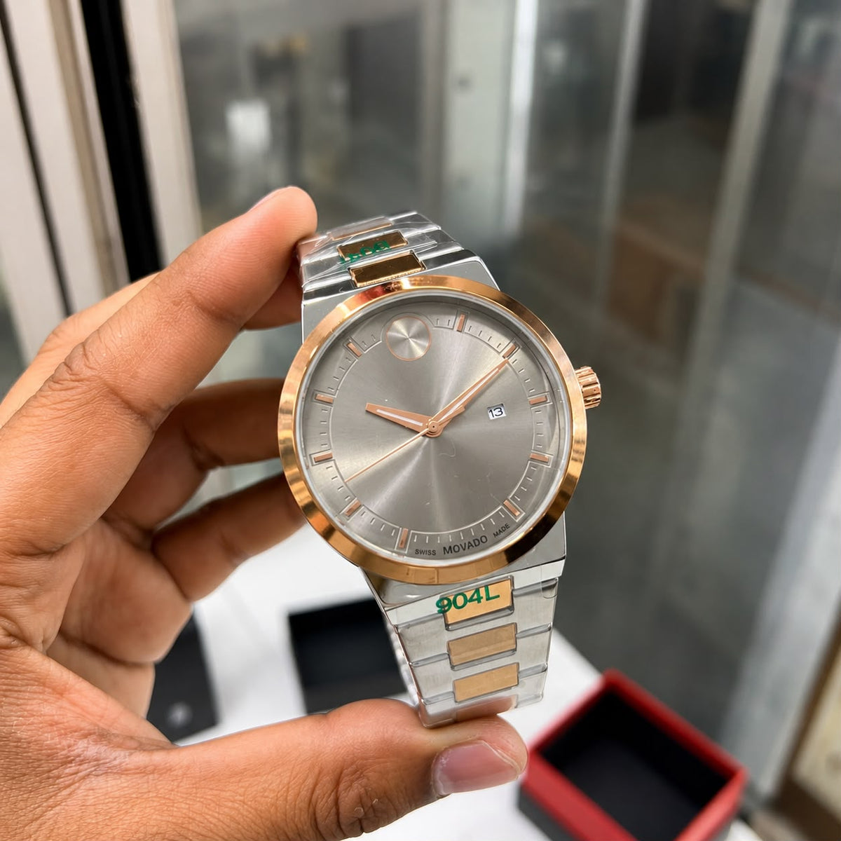 *Luxury gold-tone Mo@vado watch with a sleek silver dial and premium finish.*_S7