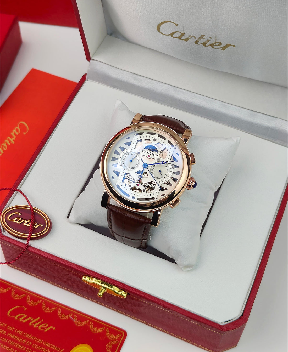 CA_TIER AUTOMATIC WATCH WITH A SKELETONIZED DIAL A BROWN LEATHER STRAP DAY AND DATE INDICATORS_J19
