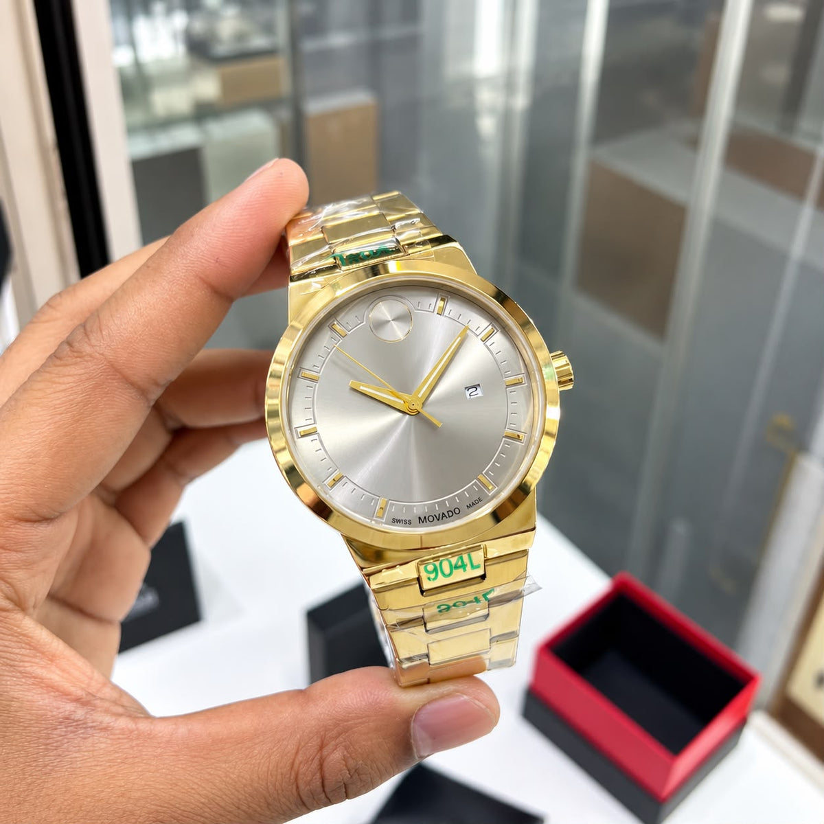 *Luxury gold-tone Mo@vado watch with a sleek silver dial and premium finish.*_S7