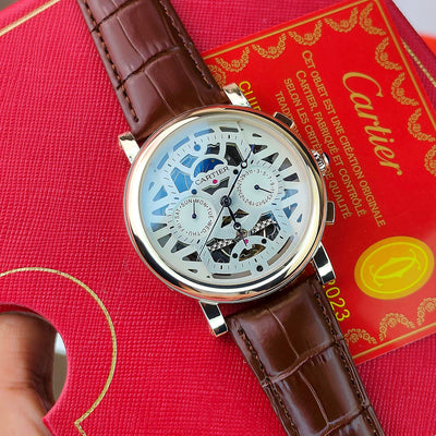 CA_TIER AUTOMATIC WATCH WITH A SKELETONIZED DIAL A BROWN LEATHER STRAP DAY AND DATE INDICATORS_J19