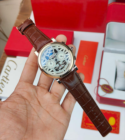 CA_TIER AUTOMATIC WATCH WITH A SKELETONIZED DIAL A BROWN LEATHER STRAP DAY AND DATE INDICATORS_J19