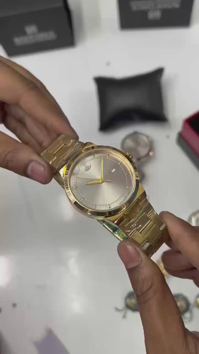 *Luxury gold-tone Mo@vado watch with a sleek silver dial and premium finish.*_S7